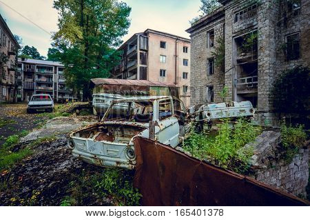 Abandoned mining ghost-town Jantuha, Abkhazia. Destroyed empty houses, the remains of the cars, remnant of The Georgian-Abkhazian war