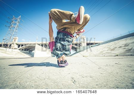 bbyos doing some stunts - Street artist breakdancing outdoors