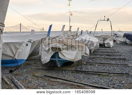 detail of same boats in a beach in arenzano