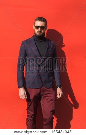 MILAN ITALY - JANUARY 14: Fashionable man poses outside Antonio Marras fashion show building during Milan Men's Fashion Week on JANUARY 14 2017 in Milan.