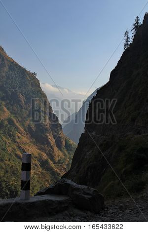 Scene on the way to Chame Annapurna Conservation Area Nepal. Deep narrow valley.