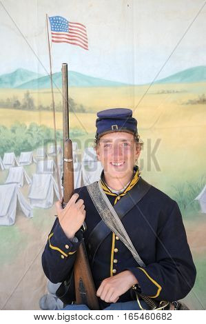 JULY 24, 2015. CASPER, WYOMING. CIRCA: Young calvary reenactor military male recruit posing for the camera outdoors at the annual pioneer day in Casper.