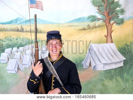 JULY 24, 2015. CASPER, WYOMING. CIRCA: Young calvary reenactor military male recruit posing for the camera outdoors at the annual pioneer day in Casper.