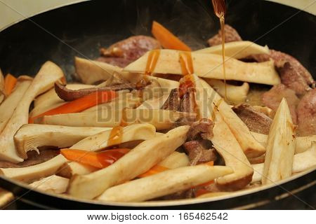Cooking ,fried Eryngii Mushroom With Pork Liver And Carrot.