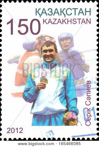 KAZAKHSTAN - CIRCA 2012: Postage stamp printed in Kazakhstan shows Olympic champion Serik Sapiev, who won the gold medal at the XXX Summer Olympics in London