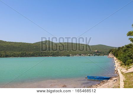 Scenin view of Abrau-Durso lake in Caucasus mountains.