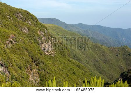 Picturesque aerial panorama of mountains and rainforest hills on Madeira island Portugal.