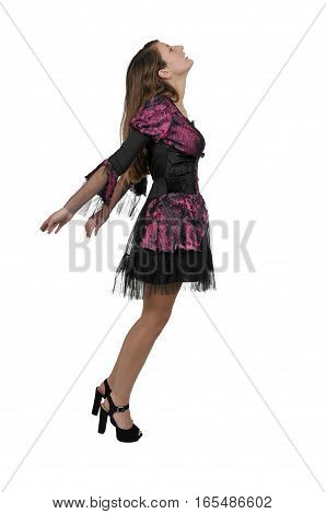 Beautiful young sexy woman in a dress and heels posing