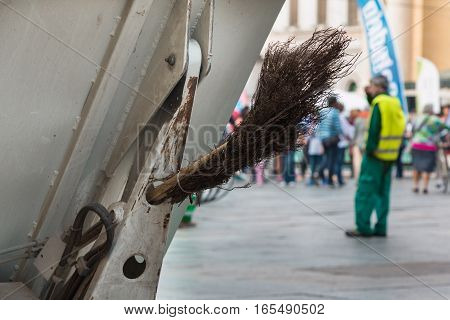 Municipal Dustman Worker with Cleaning Tools in Public Streets