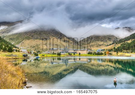 Lake in vall de Nuria under a cloudy sky