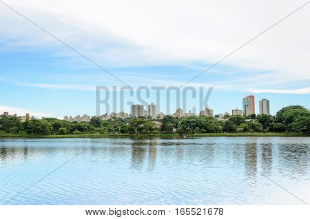 Lake Reflecting On The Water The City And The Blue Sky. Margins Of The Lake Igapo In Londrina, Pr, B