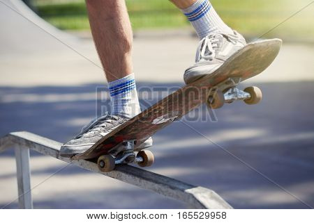 Skater Doing 5-0 Grind On Fun-box In Skatepark