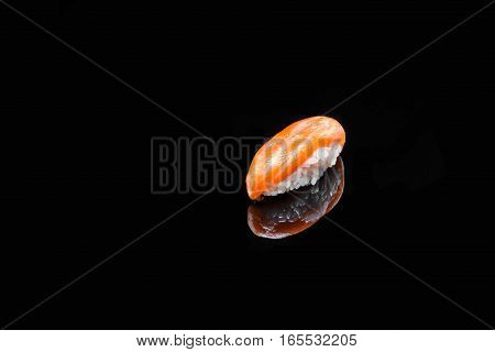 classic sushi with salmon on black background