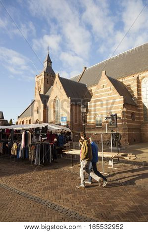 Leerdam, Netherlands, 4 january 2017: market stall and large church in old town of Leerdam in The Netherlands