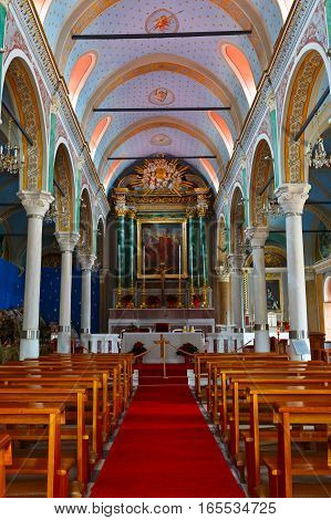 ERMOUPOLI, GREECE - JANUARY 09,2017: Interior of a church in a Capuchin monastery in Ermoupoli town on Syros island on January 09, 2017.