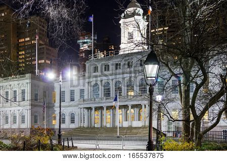 NYC City Hall building with lights at nighttime in Lower Manhattan New York City