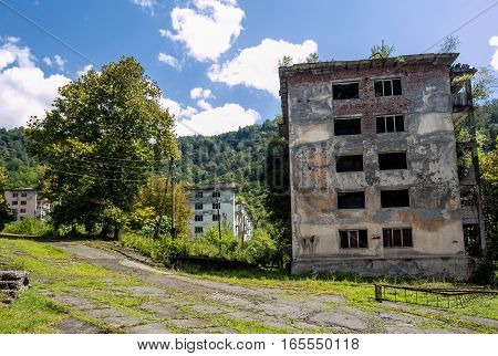 Abandoned mining ghost-town Polyana, Abkhazia. Destroyed empty houses, remnant of The Georgian-Abkhazian war