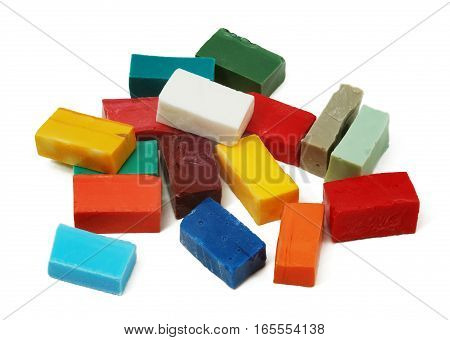 Pile of smalt tiles of different colors on white background