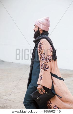MILAN ITALY - JANUARY 15: Fashionable man poses outside Damir Doma fashion show building during Milan Men's Fashion Week on JANUARY 15 2017 in Milan.