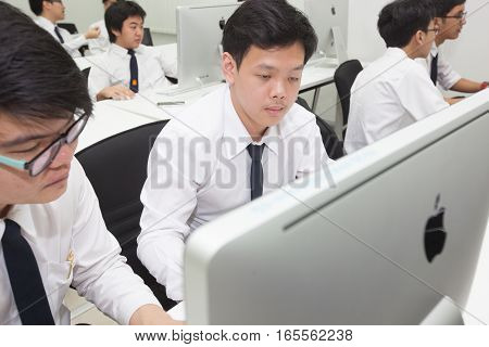 Bangkok, Thailand - November 17, 2015 : 
King Mongkut's Institute of Technology Ladkrabang is a research and educational institution in Thailand.
A class of students in front of their screens study computer science.