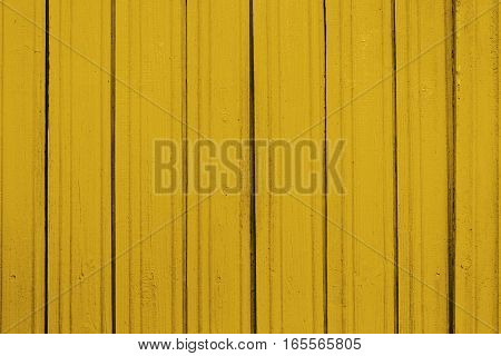 Texture of old wooden planks with peeling color paint