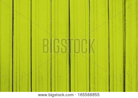 Texture of old wooden planks with peeling color paint