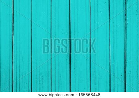 Texture of old wooden planks with peeling color paint
