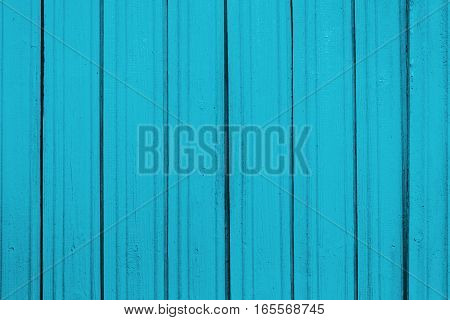 Texture of old wooden planks with peeling color paint