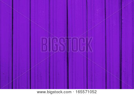 Texture of old wooden planks with peeling color paint