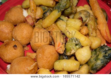 Mix of fried vegetables, potatoes and mozzarella cheese