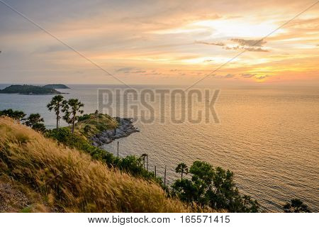 Promthep Cape is a mountain of rock that extends into the sea view point sunset at Phuket Thailand