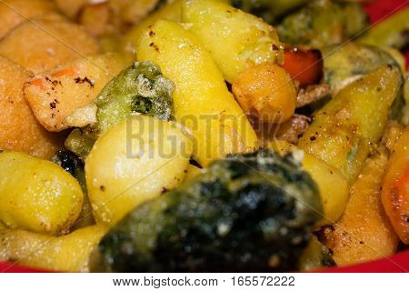 Mix of fried vegetables, potatoes and mozzarella cheese