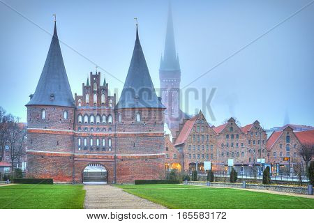 Holsten Gate Of Lubeck In Germany At Dawn