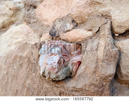 A piece of marble, embedded in the wall of the castle of Santa Barbara, Alicante