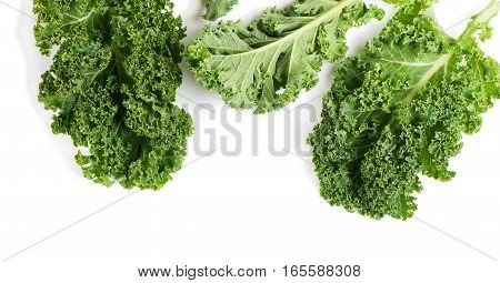 Top view of raw leaves of kale isolated on white background.
