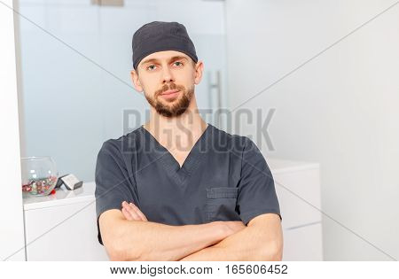 Happy friendly doctor in the clinic Happy friendly doctor in the clinic