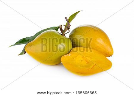 ripe Tiesa or egg fruit with stem and leaves on white background
