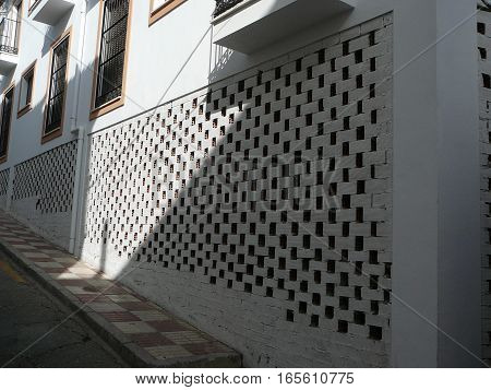 Newly constructed empty building with Bricked upwhite painted wall