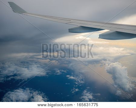 Carpentaria, Australia - Oct 29, 2016: Plane flying between cloud layers out of the Gulf of Carpentaria, northward towards the Asian continent. Weather condition changing.
