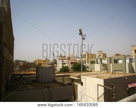 View of city from roof. Cityscape. Buildings against sky.