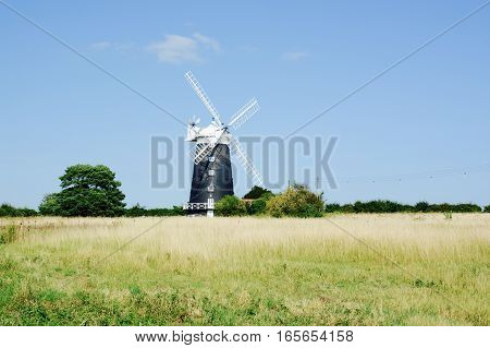 BURNHAM OVERY STAITHE, UK - AUGUST 30, 2016: The tower Windmill, built in 1816 was used as a corn ill until damaged by a storm, Norfolk, UK
