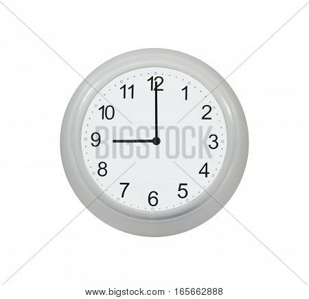 Wall watch showing nine o'clock isolated on white background
