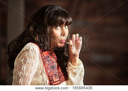 Woman With Uneasy Expression Smoking