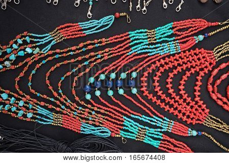 colourful microbead jewelery closeup in Otavalo market Ecuador