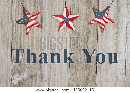 USA patriotic thank you message USA patriotic old flag on a stars with weathered wood background with text Thank you for your service