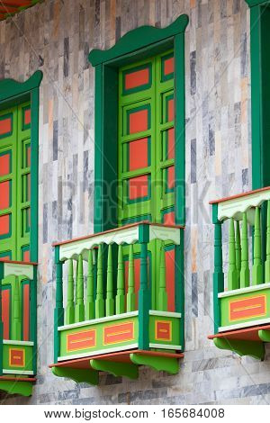 brightly coloured building balconies in Filandia coffee producing town in Colombia