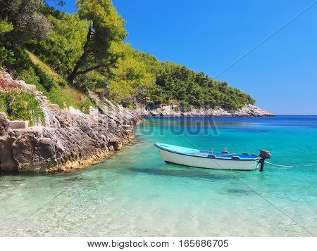 View from the beach of a boat on the sea