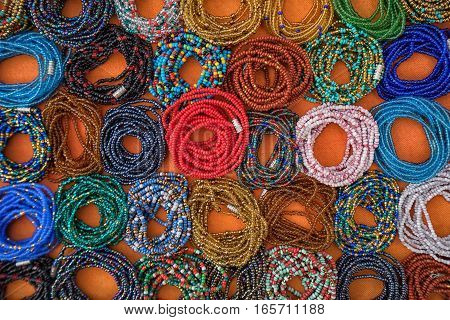 colourful microbead jewelery closeup in Otavalo market Ecuador