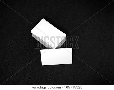 Stack of white business cards. Name cards mockup template on black leather background. 3D Rendering with shadow