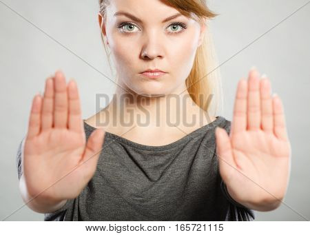 Female Shows Stop Sign By Her Hand.